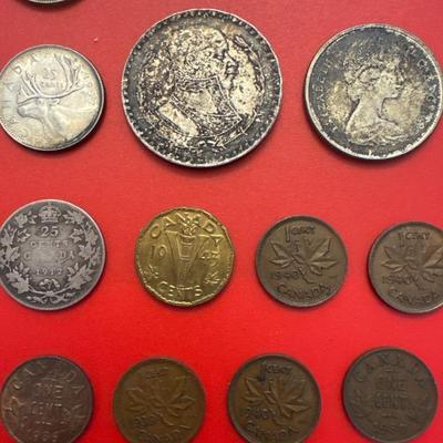 Sale Photo Thumbnail #55: Coins are from Canada, Mexico, Great Britain. 
Most are made of silver and pre-date 1940. 
Notable coins include: 
(2) 1919 Canadian $.25 (92.5% Silver) 
1912 Canadian $.25 (92.5% Silver)
1876 Great Britain 1 Schilling (92.5% Silver)
1964 Mexican one peso