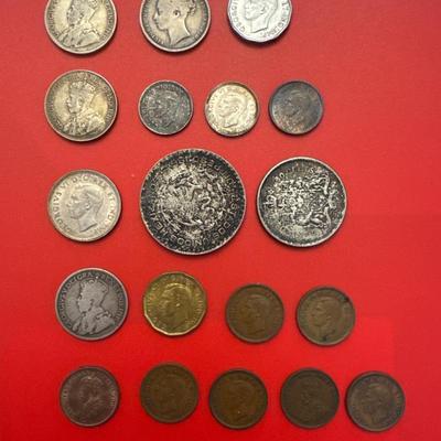 Sale Photo Thumbnail #49: Coins are from Canada, Mexico, Great Britain. 
Most are made of silver and pre-date 1940. 
Notable coins include: 
(2) 1919 Canadian $.25 (92.5% Silver) 
1912 Canadian $.25 (92.5% Silver)
1876 Great Britain 1 Schilling (92.5% Silver)
1964 Mexican one peso