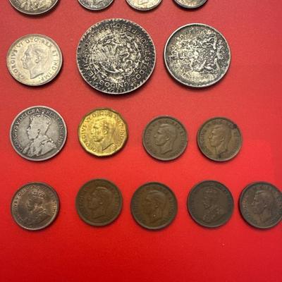 Sale Photo Thumbnail #51: Coins are from Canada, Mexico, Great Britain. 
Most are made of silver and pre-date 1940. 
Notable coins include: 
(2) 1919 Canadian $.25 (92.5% Silver) 
1912 Canadian $.25 (92.5% Silver)
1876 Great Britain 1 Schilling (92.5% Silver)
1964 Mexican one peso