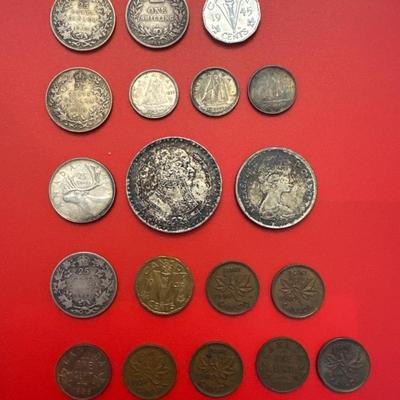 Sale Photo Thumbnail #53: Coins are from Canada, Mexico, Great Britain. 
Most are made of silver and pre-date 1940. 
Notable coins include: 
(2) 1919 Canadian $.25 (92.5% Silver) 
1912 Canadian $.25 (92.5% Silver)
1876 Great Britain 1 Schilling (92.5% Silver)
1964 Mexican one peso
