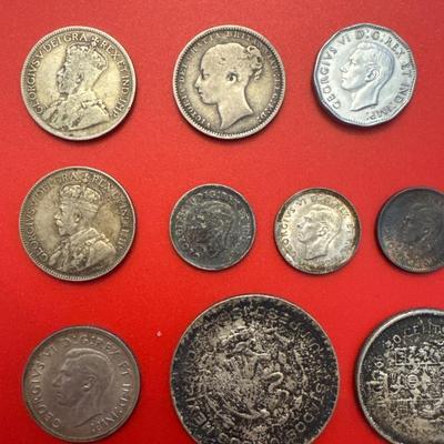 Sale Photo Thumbnail #50: Coins are from Canada, Mexico, Great Britain. 
Most are made of silver and pre-date 1940. 
Notable coins include: 
(2) 1919 Canadian $.25 (92.5% Silver) 
1912 Canadian $.25 (92.5% Silver)
1876 Great Britain 1 Schilling (92.5% Silver)
1964 Mexican one peso