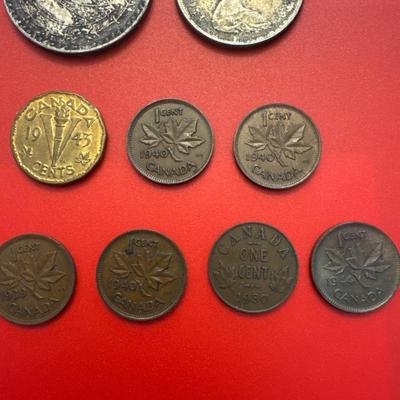 Sale Photo Thumbnail #56: Coins are from Canada, Mexico, Great Britain. 
Most are made of silver and pre-date 1940. 
Notable coins include: 
(2) 1919 Canadian $.25 (92.5% Silver) 
1912 Canadian $.25 (92.5% Silver)
1876 Great Britain 1 Schilling (92.5% Silver)
1964 Mexican one peso