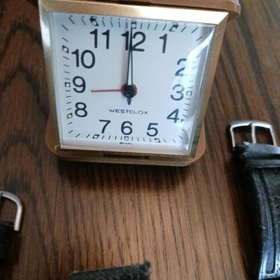 3 MEN'S WATCHES AND A TRAVELING ALARM CLOCK