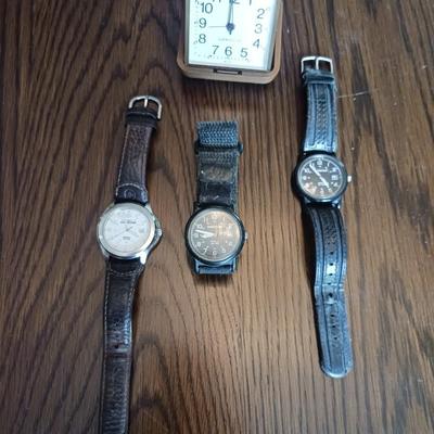 3 MEN'S WATCHES AND A TRAVELING ALARM CLOCK