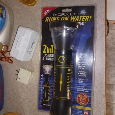 CLEANING SUPPLIES, FLASHLIGHT THAT RUNS ON WATER AND TIKI TORCH FUEL