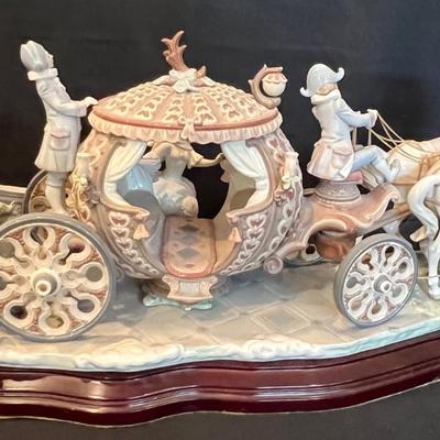 Sale Photo Thumbnail #206: RARE SIGNED LLADRO 1493 CINDERELLA COACH AT THE STROKE OF TWELVE LTD ED RETIRED. Up for sale is this Pre-owned Lladro "Cinderella" At the Stroke of Twelve. Large Figurine w/ hardwood base. Please view all photos and description before you buy. Presented f