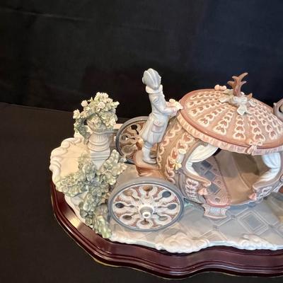 Sale Photo Thumbnail #205: RARE SIGNED LLADRO 1493 CINDERELLA COACH AT THE STROKE OF TWELVE LTD ED RETIRED. Up for sale is this Pre-owned Lladro "Cinderella" At the Stroke of Twelve. Large Figurine w/ hardwood base. Please view all photos and description before you buy. Presented f