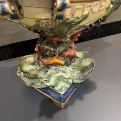 Sale Photo Thumbnail #339: 24" Tall, Missing a Staff or sword. Antique! Collectible. 
Very large and imposing majolica, Baroque revival centerpiece of a river mermaid riding a Spanish galleon. This piece is titled NIXE, a water sprite of German origin. It is unmarked but may possib