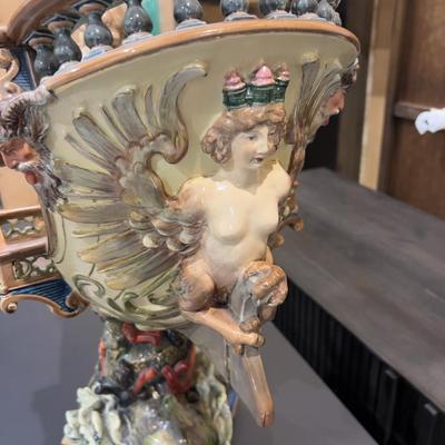 Sale Photo Thumbnail #335: 24" Tall, Missing a Staff or sword. Antique! Collectible. 
Very large and imposing majolica, Baroque revival centerpiece of a river mermaid riding a Spanish galleon. This piece is titled NIXE, a water sprite of German origin. It is unmarked but may possib