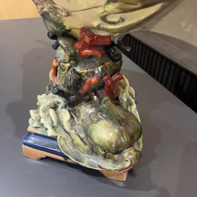 Sale Photo Thumbnail #336: 24" Tall, Missing a Staff or sword. Antique! Collectible. 
Very large and imposing majolica, Baroque revival centerpiece of a river mermaid riding a Spanish galleon. This piece is titled NIXE, a water sprite of German origin. It is unmarked but may possib