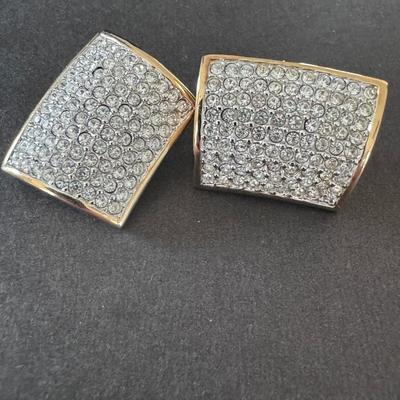 Sale Photo Thumbnail #393: Vintage Swarovski Pave Faux Diamond Gold Tone Clip On Earrings. 
Here's more information about these types of earrings:
Design & Material: These earrings feature a gold-tone base densely embellished with numerous clear Swarovski crystals in a pave setting