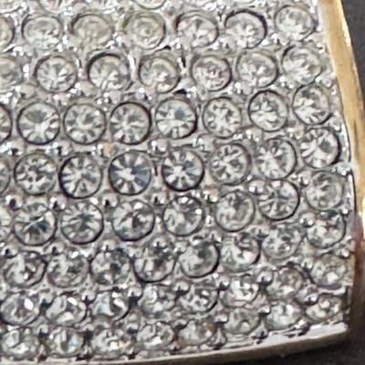 Sale Photo Thumbnail #396: Vintage Swarovski Pave Faux Diamond Gold Tone Clip On Earrings. 
Here's more information about these types of earrings:
Design & Material: These earrings feature a gold-tone base densely embellished with numerous clear Swarovski crystals in a pave setting