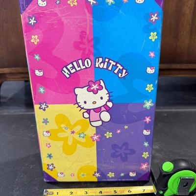 Sale Photo Thumbnail #726: Type of Item: It appears to be a vintage or retro-style storage trunk or case, likely used for holding toys, crafts, stationery, or other small treasures.
Design: The trunk features the iconic Hello Kitty character and vibrant, multi-colored panels, consi