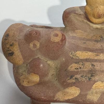 Sale Photo Thumbnail #157: The image shows a Pre-Columbian style Nayarit ceramic figure, likely from West Mexico (modern-day Nayarit state). These figures are characteristic of the Late Formative and Early Classic periods, roughly dating from 300 BCE to 450 CE. 
Key details about N