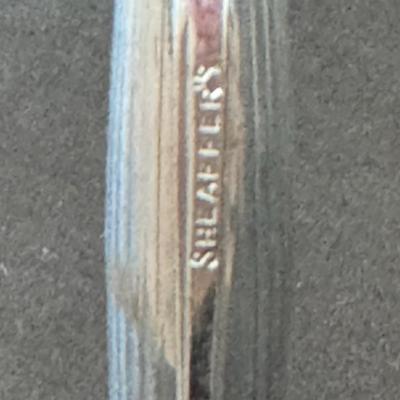 Sale Photo Thumbnail #119: Sheaffer pen, specifically identified by the "SHEAFFER'S" engraving visible on the pen's body. 
About Sheaffer Pens:
Founded: Sheaffer Pen Corporation was founded in Fort Madison, Iowa, in 1913 by Walter A. Sheaffer, who patented a lever-filling fountain 