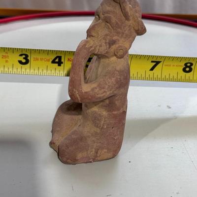 Sale Photo Thumbnail #161: The figure in your image is a Vintage "Portrait of Anxiety/Depression" Clay Pottery Figure, which is a 1960s promotional piece for a prescription drug company in Mexico, believed to be Etrafon. 
Here's more information about this intriguing figure:
Origin