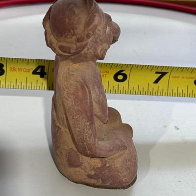 Sale Photo Thumbnail #162: The figure in your image is a Vintage "Portrait of Anxiety/Depression" Clay Pottery Figure, which is a 1960s promotional piece for a prescription drug company in Mexico, believed to be Etrafon. 
Here's more information about this intriguing figure:
Origin