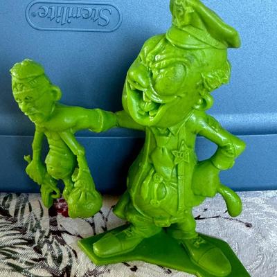 Sale Photo Thumbnail #80: A green figure from the Marx Nutty Mads toy line. This particular figure is named All-Heart Hogan, and represents a policeman. He was part of the Series 2 release of these figures by the Marx Toy Company in 1963-1964.