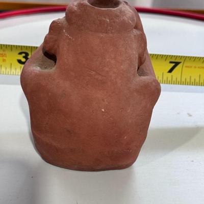Sale Photo Thumbnail #164: The terracotta figure in the image is a vintage promotional item used by Schering Pharmaceuticals to advertise the drug Etrafon, which was prescribed for anxiety and depression. 
Key details about this figure:
Origin: It is a reproduction of an ancient te