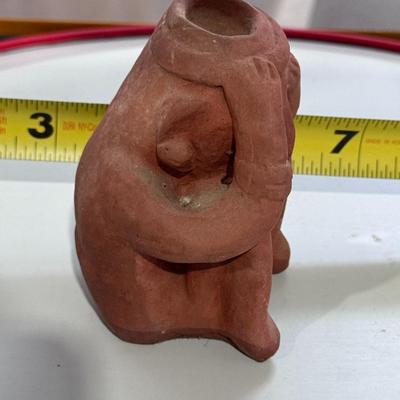 Sale Photo Thumbnail #165: The terracotta figure in the image is a vintage promotional item used by Schering Pharmaceuticals to advertise the drug Etrafon, which was prescribed for anxiety and depression. 
Key details about this figure:
Origin: It is a reproduction of an ancient te