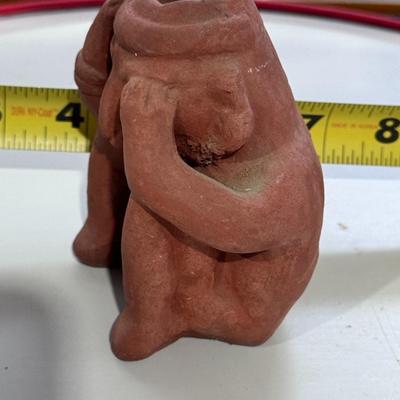 Sale Photo Thumbnail #166: The terracotta figure in the image is a vintage promotional item used by Schering Pharmaceuticals to advertise the drug Etrafon, which was prescribed for anxiety and depression. 
Key details about this figure:
Origin: It is a reproduction of an ancient te