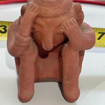 Sale Photo Thumbnail #163: The terracotta figure in the image is a vintage promotional item used by Schering Pharmaceuticals to advertise the drug Etrafon, which was prescribed for anxiety and depression. 
Key details about this figure:
Origin: It is a reproduction of an ancient te