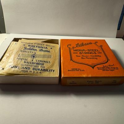 Sale Photo Thumbnail #737: vintage orange box of Gibson Mona-Steel strings. These strings are described as "hand made" and offer "Tone-Power-Durability Non-Tarnishing", according to the box label.