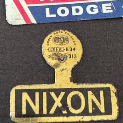 Sale Photo Thumbnail #572: vintage political campaign memorabilia, specifically featuring:
Nixon Lodge Campaign Button (top): This pinback button promotes Richard Nixon's 1960 presidential campaign, where Henry Cabot Lodge Jr. was his running mate for Vice President. These buttons 