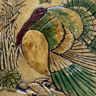 Sale Photo Thumbnail #616: The image shows a vintage studio art pottery turkey platter. These platters are commonly used for serving during Thanksgiving or as decorative items for fall seasonal decor. 
Here's some information about such platters:
Design and Features: They typically