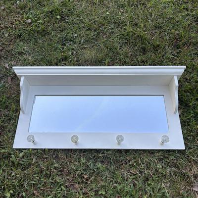 LOT 48: White Chest of Drawer, Mirrored Shelf w/Glass Pegs along with 2-Over the Door Hanging Clothes Racks