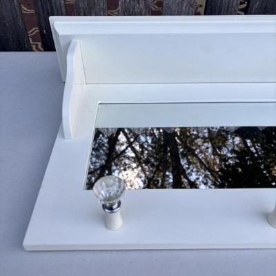 LOT 48: White Chest of Drawer, Mirrored Shelf w/Glass Pegs along with 2-Over the Door Hanging Clothes Racks