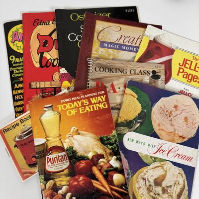 LOT 73: Porcelain Chef Pig & Assistant, Vintage Aprons & Cookbooks, Flatware, Cherry Wood Bowl & More