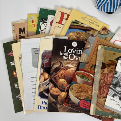 LOT 73: Porcelain Chef Pig & Assistant, Vintage Aprons & Cookbooks, Flatware, Cherry Wood Bowl & More