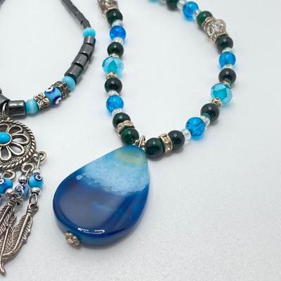 LOT 111: Collection of Beaded Pendant Necklaces - Robert Rose and More