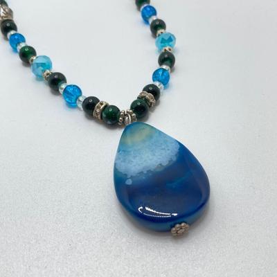 LOT 111: Collection of Beaded Pendant Necklaces - Robert Rose and More