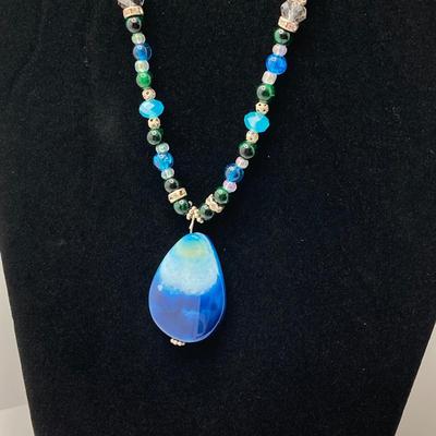 LOT 111: Collection of Beaded Pendant Necklaces - Robert Rose and More