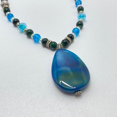 LOT 111: Collection of Beaded Pendant Necklaces - Robert Rose and More
