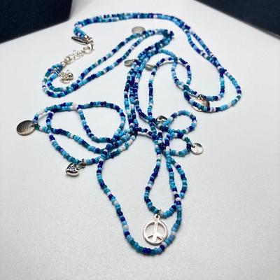 LOT 111: Collection of Beaded Pendant Necklaces - Robert Rose and More