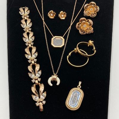 LOT 115: Vintage Gold Tone Jewelry - Trifari, Avon and More