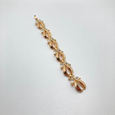 LOT 115: Vintage Gold Tone Jewelry - Trifari, Avon and More