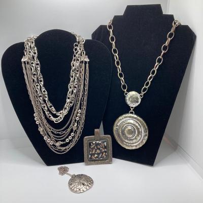 LOT 134: Silver Tone Pendant Necklaces / Chains