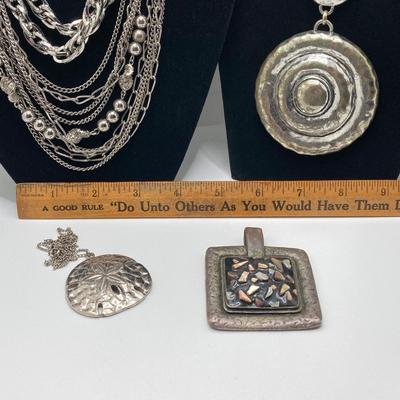 LOT 134: Silver Tone Pendant Necklaces / Chains