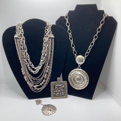 LOT 134: Silver Tone Pendant Necklaces / Chains