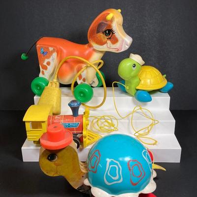 LOT 151: Vintage Fisher Price Toy Collection - Cow, Turtles and Toot Toot Train