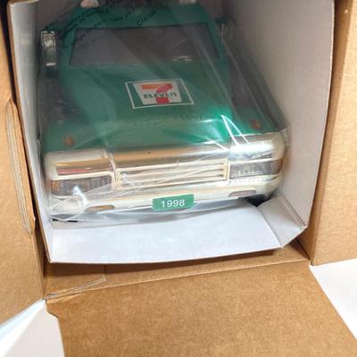LOT 154: Cool Toy Truck Collection - Jada Toys Tow Truck, 1998 7-Eleven Collectible Toy Wrecker and Wooden Flat Bed Tractor / Trailer