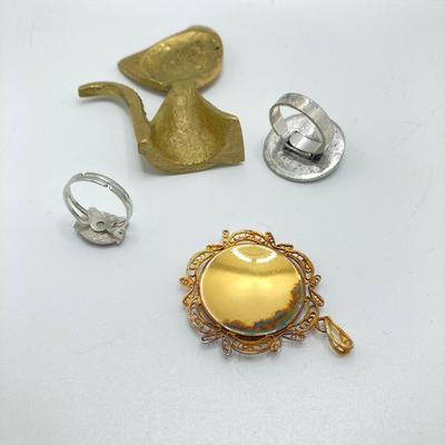 LOT 164: Vintage Jewelry and Ring Holder - Gold Tone Cat Ring Holder, Damascene Pendant, Mood Ring and More
