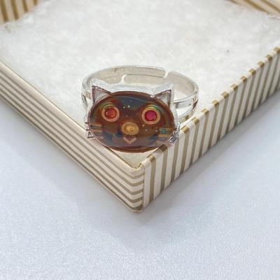 LOT 164: Vintage Jewelry and Ring Holder - Gold Tone Cat Ring Holder, Damascene Pendant, Mood Ring and More