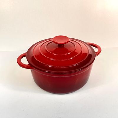 LOT 171: Red Enamel Dutch Oven and Orange / Red Le Creuset Oval Baking Dish