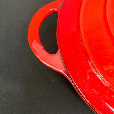 LOT 171: Red Enamel Dutch Oven and Orange / Red Le Creuset Oval Baking Dish