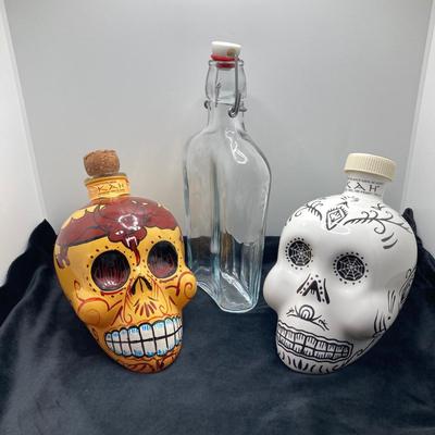 LOT 177: Pair of Kah Tequila Scull Bottles / Decanters, Set of Four Rocks Glasses and Glass Bottle with Wire Bail Swing Top Lid